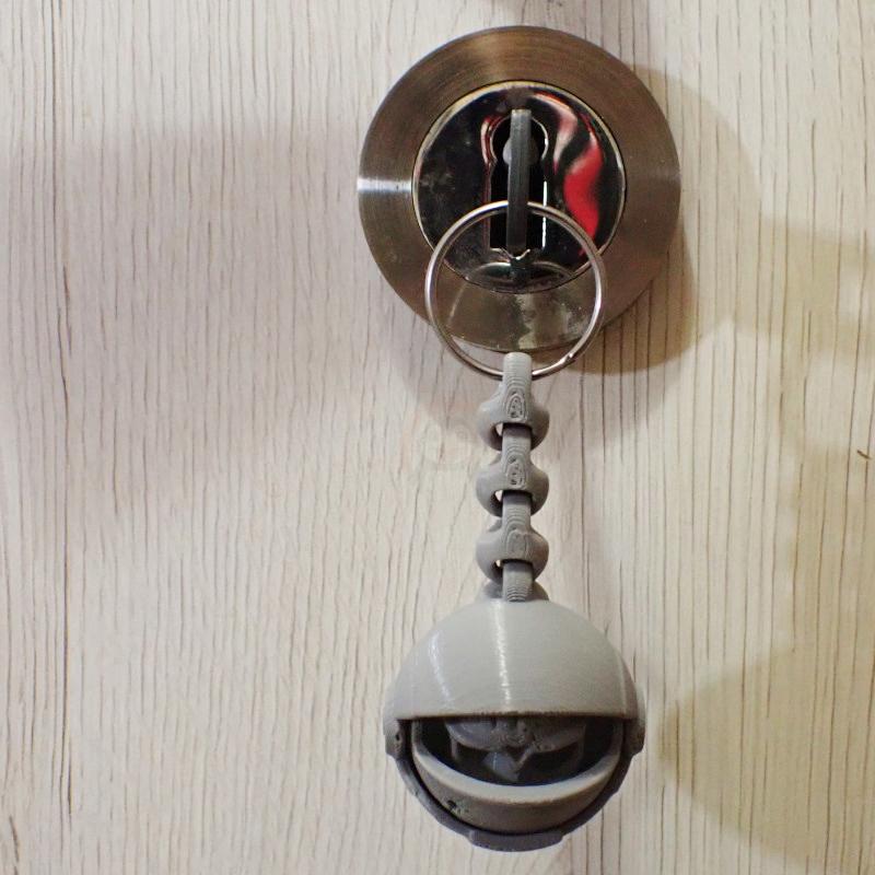 Přívěsek na klíče Lebka Astronauta páteř