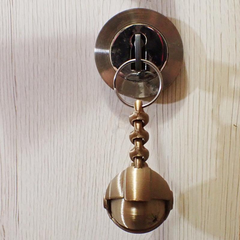 Přívěsek na klíče Lebka Astronauta